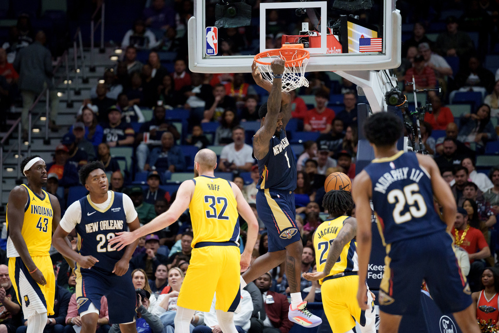 New Orleans Pelicans forward Zion Williamson (1) dunks against the Indiana Pacers during the first half of an NBA basketball game in New Orleans, Saturday, Dec. 20, 2025. (AP Photo/Matthew Hinton)
