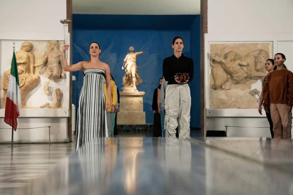 Actress Mary Mina, left, playing the role of high priestess and Ioanna Strati playing the role of Estiada perform during the final rehearsal ahead of the flame lighting for the Milan Cortina 2026 Winter Olympics, at the archaeological museum of Olympia, Greece, Tuesday, Nov. 25, 2025. (AP Photo/Thanassis Stavrakis)