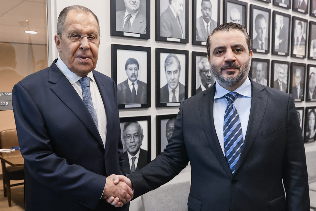 In this photo released by Russian Foreign Ministry Press Service, Syrian Foreign minister Asaad al-Shaibani, right, meets with Russian Foreign Minister Sergey Lavrov as part of the 80th session of the United Nations General Assembly at the Lotte Palace Hotel, on Thursday, Sept. 25, 2025, in New York. (Russian Foreign Ministry Press Service via AP)