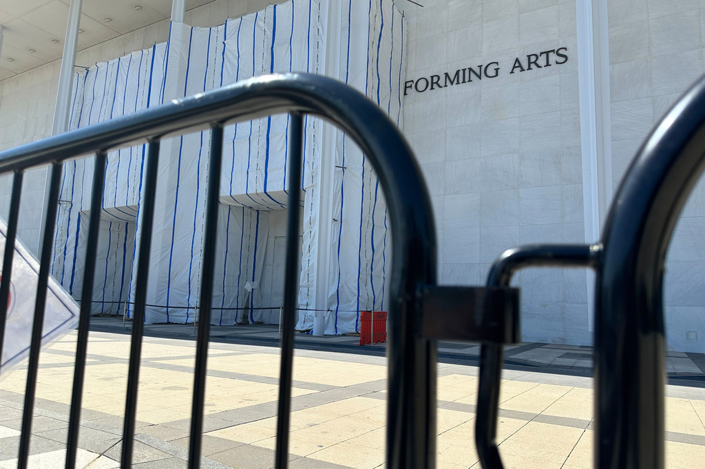 Barriers are placed outside the John F. Kennedy Center for the Performing Arts on Wednesday, Sept. 16, 2026, in Washington. (AP Photo/Nathan Ellgren)