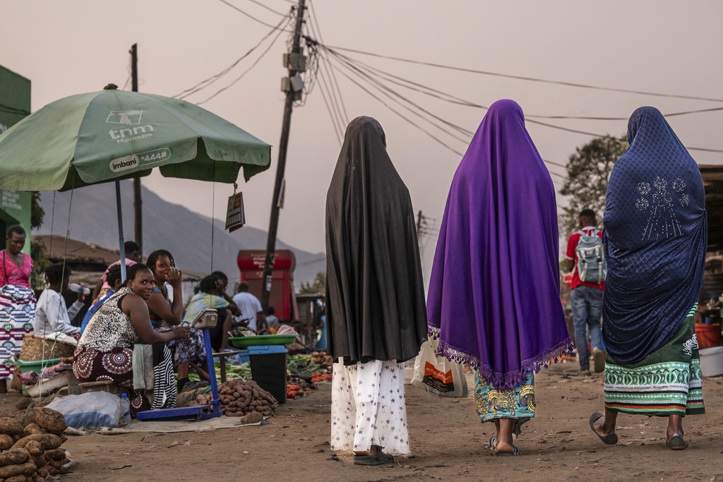 Women walk at a market in Blantyre, Malawi, Tuesday, Sept. 16, 2025. (AP Photo/Thoko Chikondi)