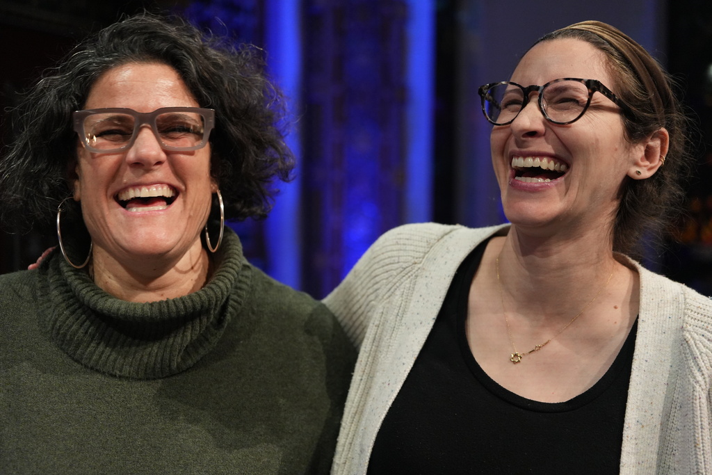 Rabbi Felicia Sol, left, senior rabbi of B'nai Jeshurun, and Rebecca Weintraub, the congregation's assistant rabbi, laugh during a Hannukah party held at the synagogue in New York, on Tuesday, Dec. 16, 2025. (AP Photo/Luis Andres Henao)