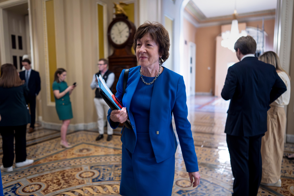Senate Appropriations Committee Chair Susan Collins, R-Maine, walks to the chamber after meeting behind closed doors with fellow Republicans on the Homeland Security budget stalemate, at the Capitol in Washington, Thursday, March 26, 2026. (AP Photo/J. Scott Applewhite)