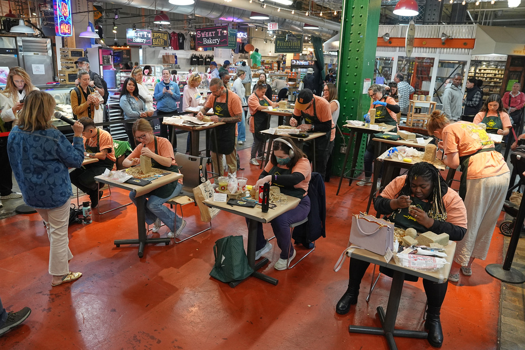 Contestants work on their entries in Scrapple Sculpting Contest at the Reading Terminal Market in Philadelphia, Friday, Oct. 10, 2025. (AP Photo/Matt Rourke)