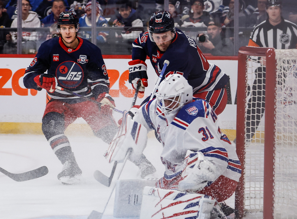 New York Rangers goaltender Igor Shesterkin (31) saves the shot from Winnipeg Jets' Cole Koepke (45) during the second period of an NHL game in Winnipeg, Thursday, March 12, 2026. (John Woods/The Canadian Press via AP)