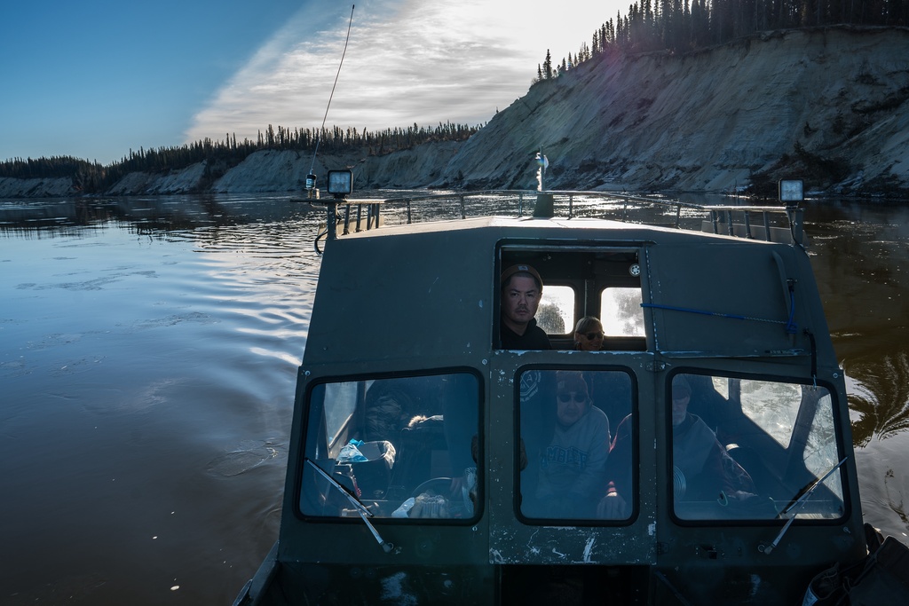 Tristen Pattee hunts with his family along the Kobuk River near Ambler, Alaska, where heavy rains have contributed to riverbank erosion Tuesday, Sept. 30, 2025. (AP Photo/Annika Hammerschlag)