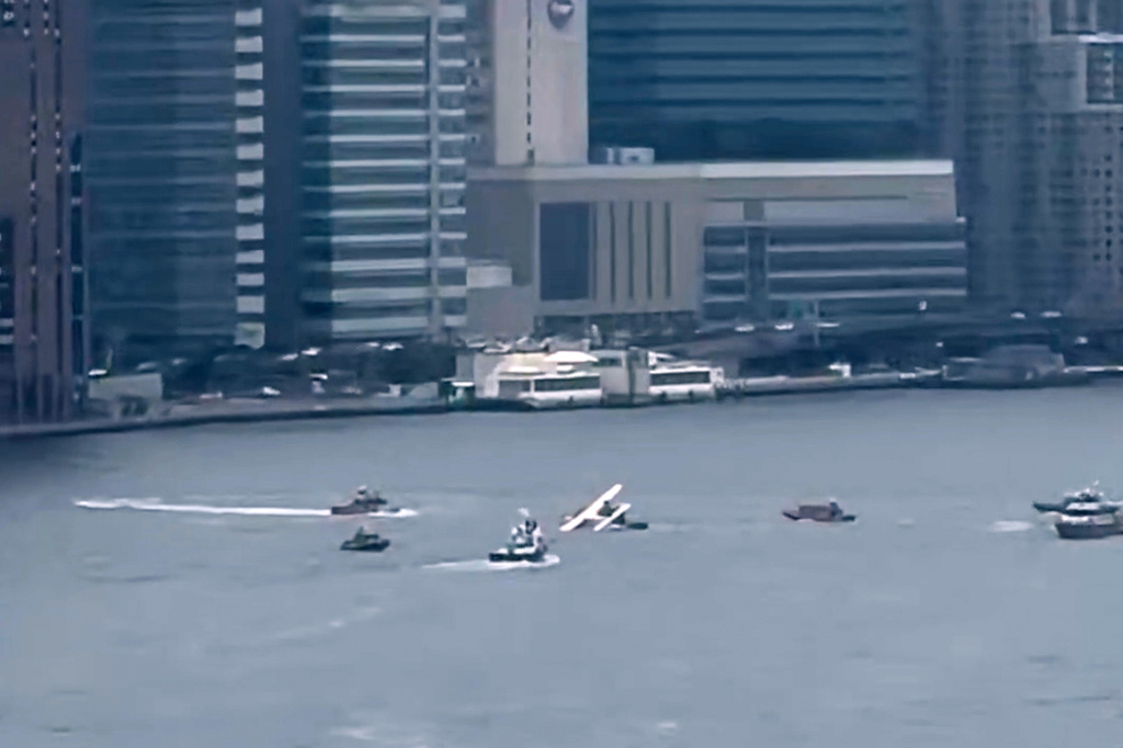 This image taken from video shows a seaplane after it made a rough landing in New York City's East River on Sunday, July 5, 2026, resulting in two minor injuries. (@brianmichaelf/X via AP)