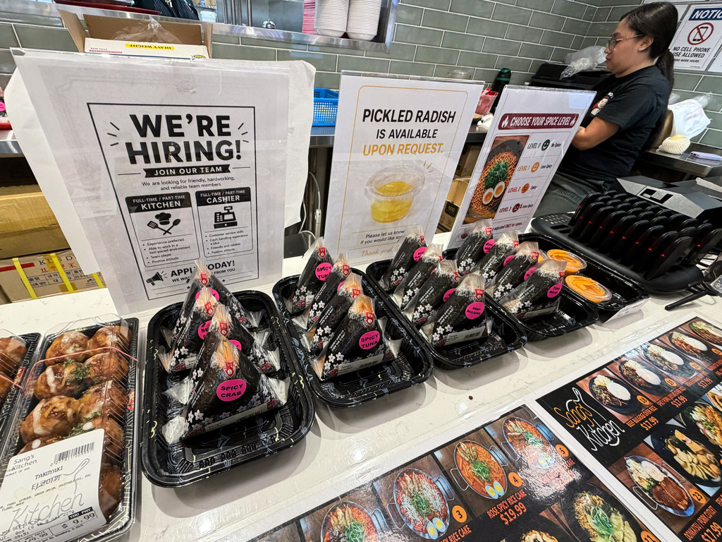 A hiring sign is displayed at a food court in a grocery store, in Schaumburg, Ill., Wednesday, Sept. 16, 2026. (AP Photo/Nam Y. Huh)