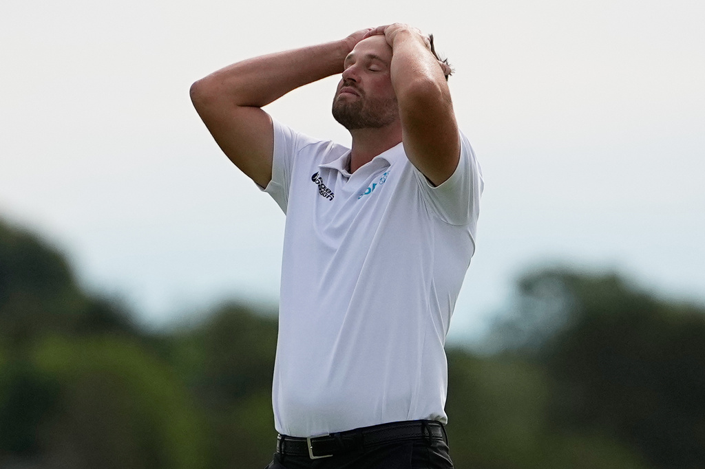 Wyndham Clark reacts after missing a putt on the 14th hole during the second round of the U.S. Open golf tournament at Shinnecock Hills Golf Club in Southampton, N.Y., Friday, June 19, 2026.(AP Photo/Gerald Herbert)