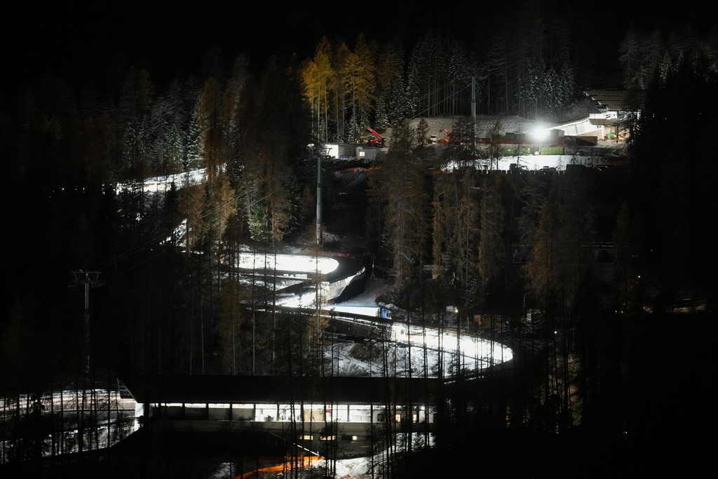 A night view of the Eugenio Monti sliding track during a three day skeleton and bobsled World Cup stage and Olympic test event in Cortina D'Ampezzo, Friday, Nov. 21, 2025. (AP Photo/Andrew Medichini)