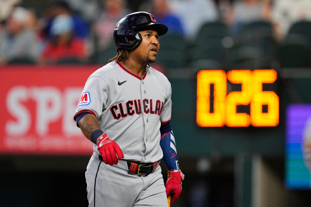 Cleveland Guardians' José Ramírez walks to the dugout after being called out on strikes in the first inning of a baseball game againts the Texas Rangers in Arlington, Texas, Sunday, June 7, 2026. (AP Photo/Tony Gutierrez)