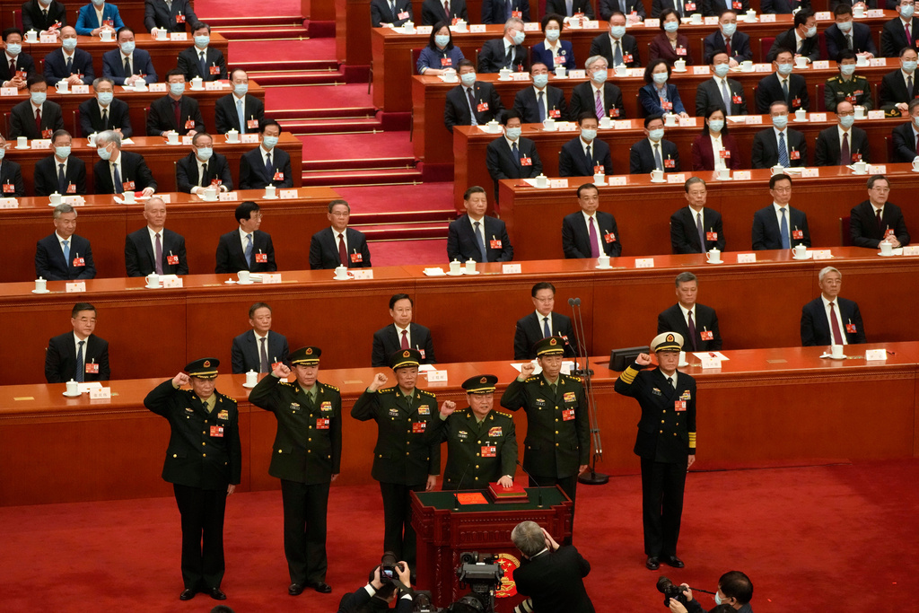 FILE - Chinese President Xi Jinping, center, watches as members of the Central Military Commission takes their oath during a session of China's National People's Congress (NPC) at the Great Hall of the People in Beijing, China on March 11, 2023. (AP Photo/Mark Schiefelbein, File)