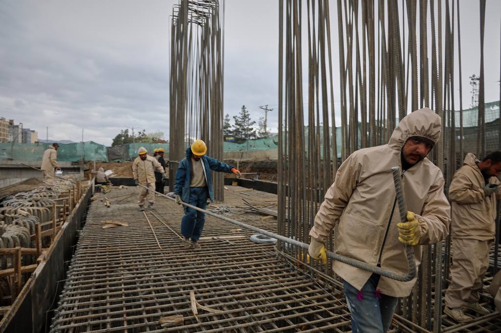 Afghan workers labor on the construction of an overpass in Baraqi square in Kabul, Afghanistan, Thursday, April 2, 2026. (AP Photo/Siddiqullah Alizai)
