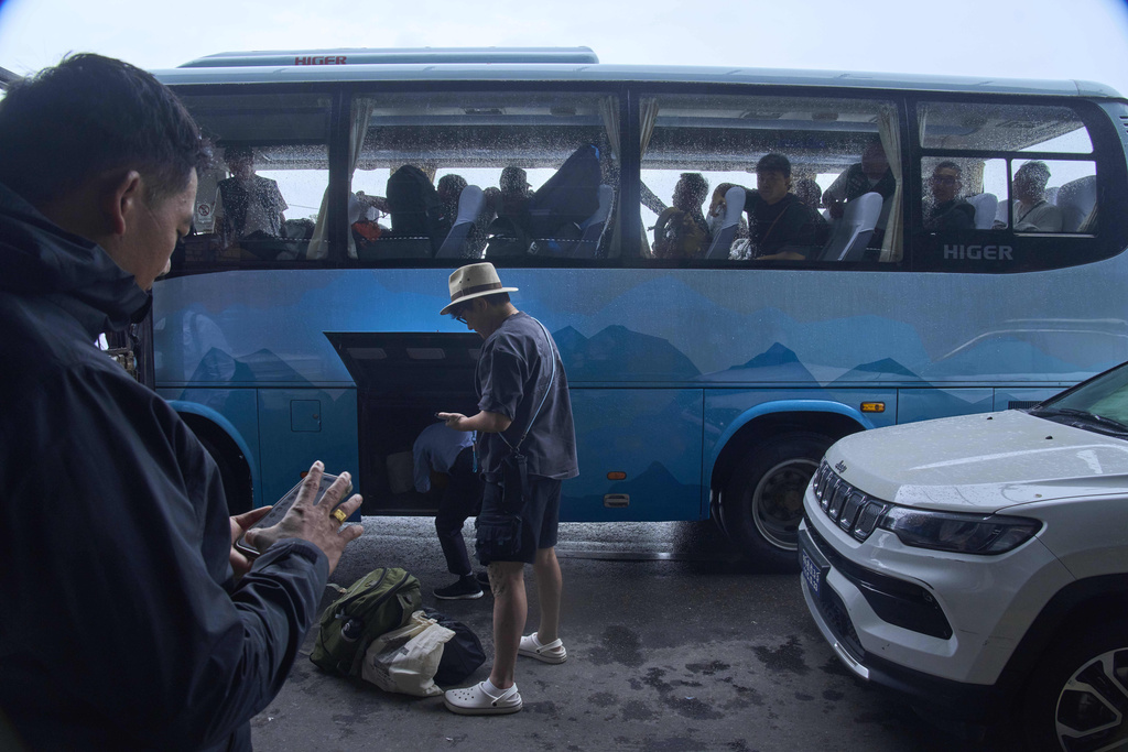 Tourists arrive to take their flight after after Nepal's international airport which was closed due to nationwide protests reopens in Kathmandu, Nepal, Thursday, Sept. 11, 2025. (AP Photo/Niranjan Shrestha)