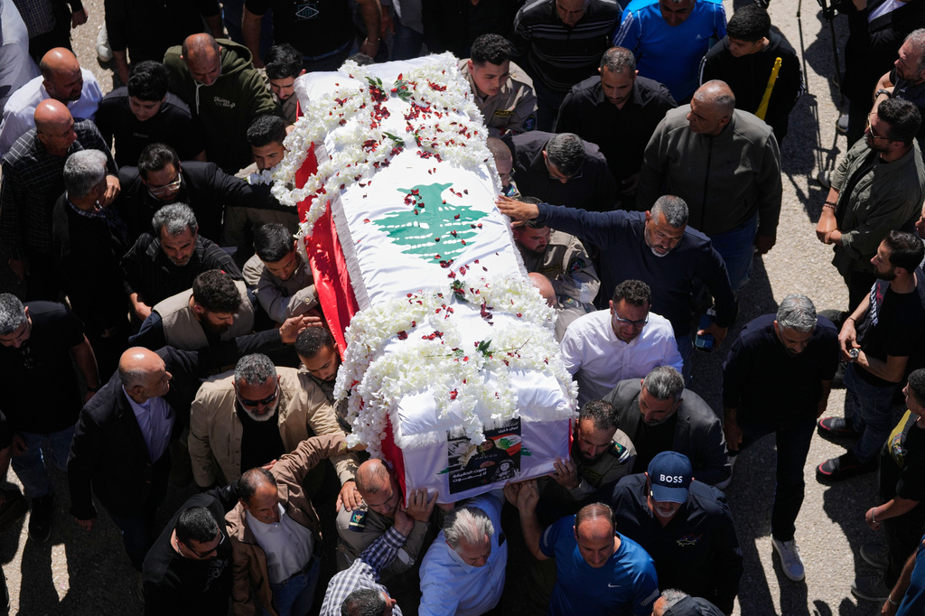 Mourners carry the coffin of Lebanese journalist Amal Khalil, who was killed Wednesday in an Israeli airstrike, during her funeral procession in the village of Baysariyeh in southern Lebanon on Thursday, April 23, 2026. (AP Photo/Mohammed Zaatari)