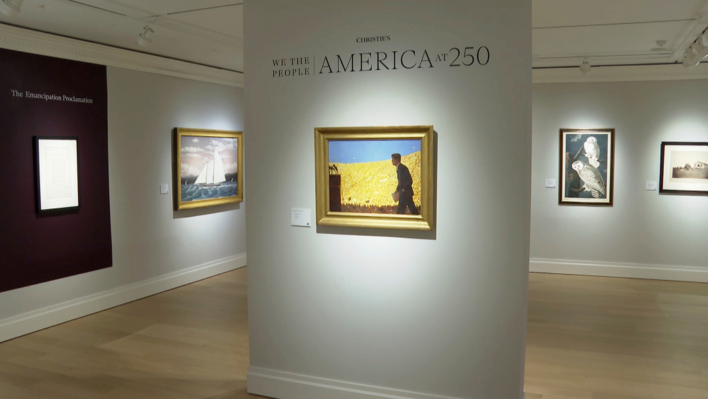 A painting depicting John F. Kennedy accepting the 1960 Democratic nomination at the Los Angeles Coliseum by Jamie Wyeth hangs on display at Christie's during a preview for the "We the People: America at 250" auction, Jan. 15, 2026 in New York. (AP Photo/Joe Frederick)