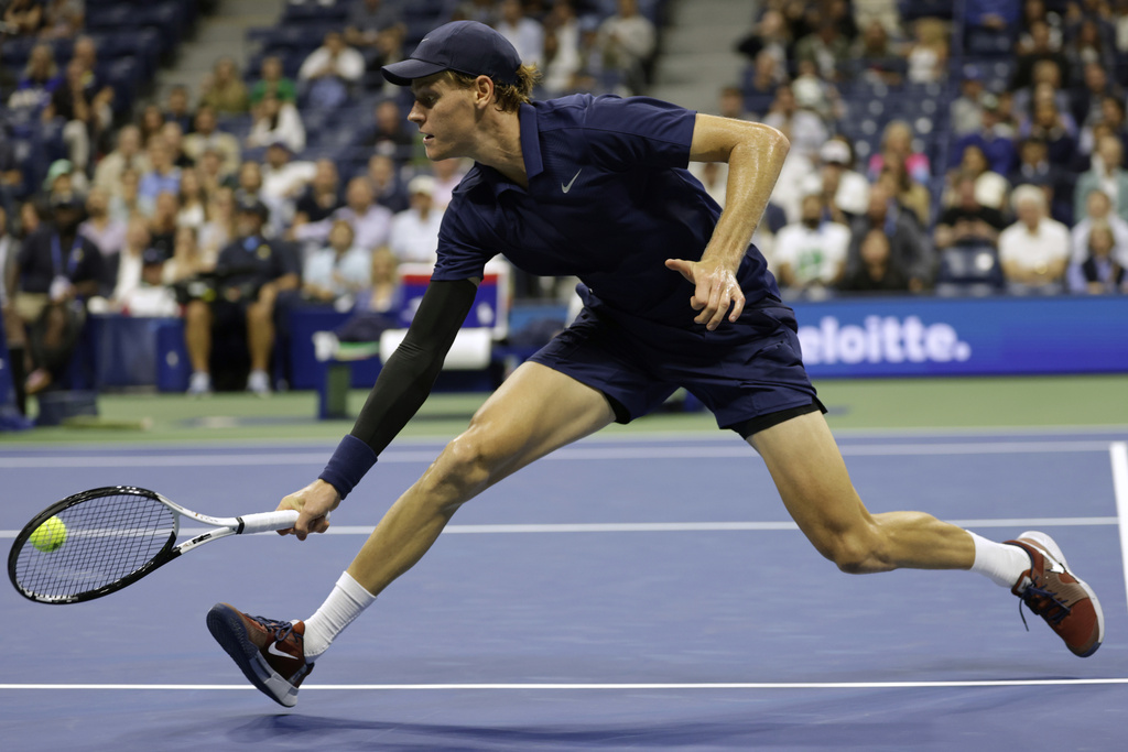 Jannik Sinner, of Italy, returns a shot to Lorenzo Musetti, of Italy, during the quarterfinal round of the U.S. Open tennis championships, Wednesday, Sept. 3, 2025, in New York. (AP Photo/Adam Hunger)