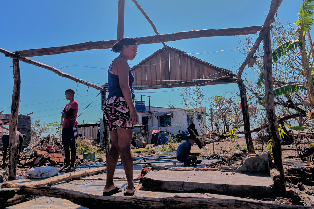 Elizandra Sorrilla poses for a photo in the ruins of her home, which was destroyed by Hurricane Melissa, in El Aserradero, Cuba, Sunday, Nov. 16, 2025. (AP Photo/Milexsy Duran)