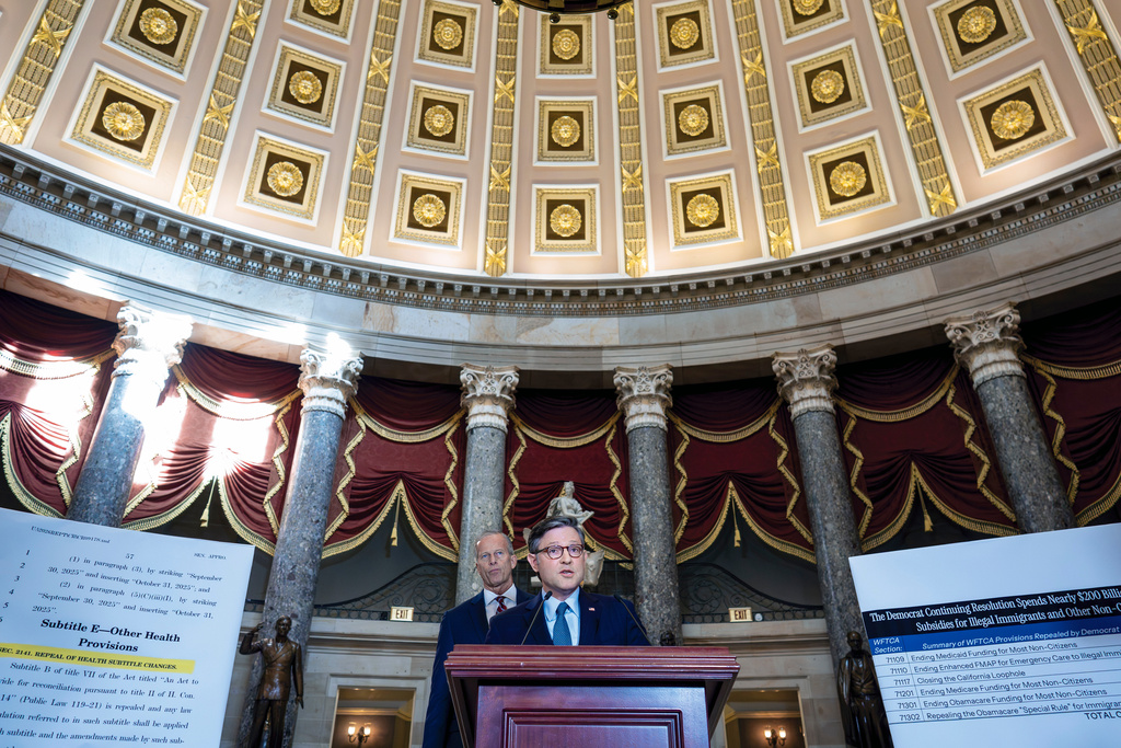 Speaker of the House Mike Johnson, R-La., and Senate Majority Leader John Thune, R-S.D., left, talk with reporters in Statuary Hall on the third day of the government shutdown, at the Capitol in Washington, Friday, Oct. 3, 2025. (AP Photo/J. Scott Applewhite)