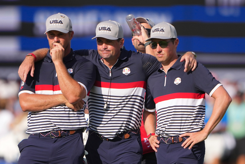 United States captain Keegan Bradley, middle, stands with Bryson DeChambeau and Ben Griffin on the 12th hole at Bethpage Black golf course during the Ryder Cup golf tournament, Friday, Sept. 26, 2025, in Farmingdale, N.Y. (AP Photo/Lindsey Wasson)