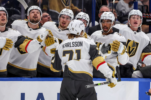 Vegas Golden Knights' William Karlsson, center, celebrates after his goal against the Tampa Bay Lightning during the first period of an NHL hockey game Sunday, Oct. 26, 2025, in Tampa, Fla. (AP Photo/Mike Carlson) Vegas Golden Knights' William Karlsson, center, celebrates after his goal against the Tampa Bay Lightning during the first period of an NHL hockey game Sunday, Oct. 26, 2025, in Tampa, Fla. (AP Photo/Mike Carlson)