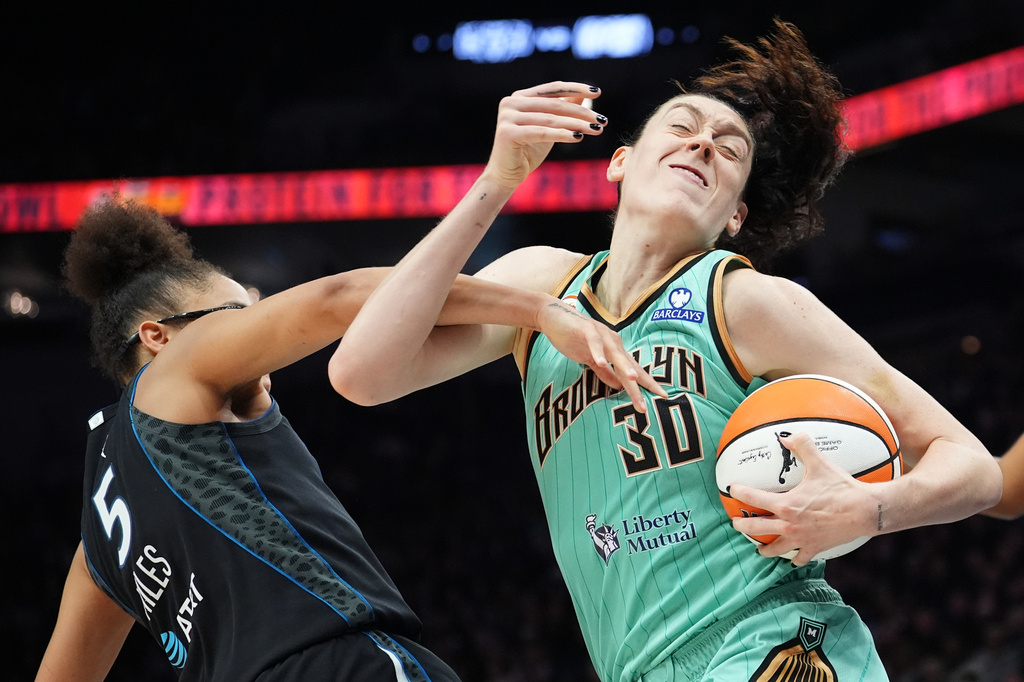 New York Liberty forward Breanna Stewart (30) battles through defense by Minnesota Lynx guard Olivia Miles (5) during the second half of Game 1 in the first round of the WNBA basketball playoffs, Sunday, Sept. 27, 2026, in Minneapolis. (AP Photo/Ellen Schmidt)