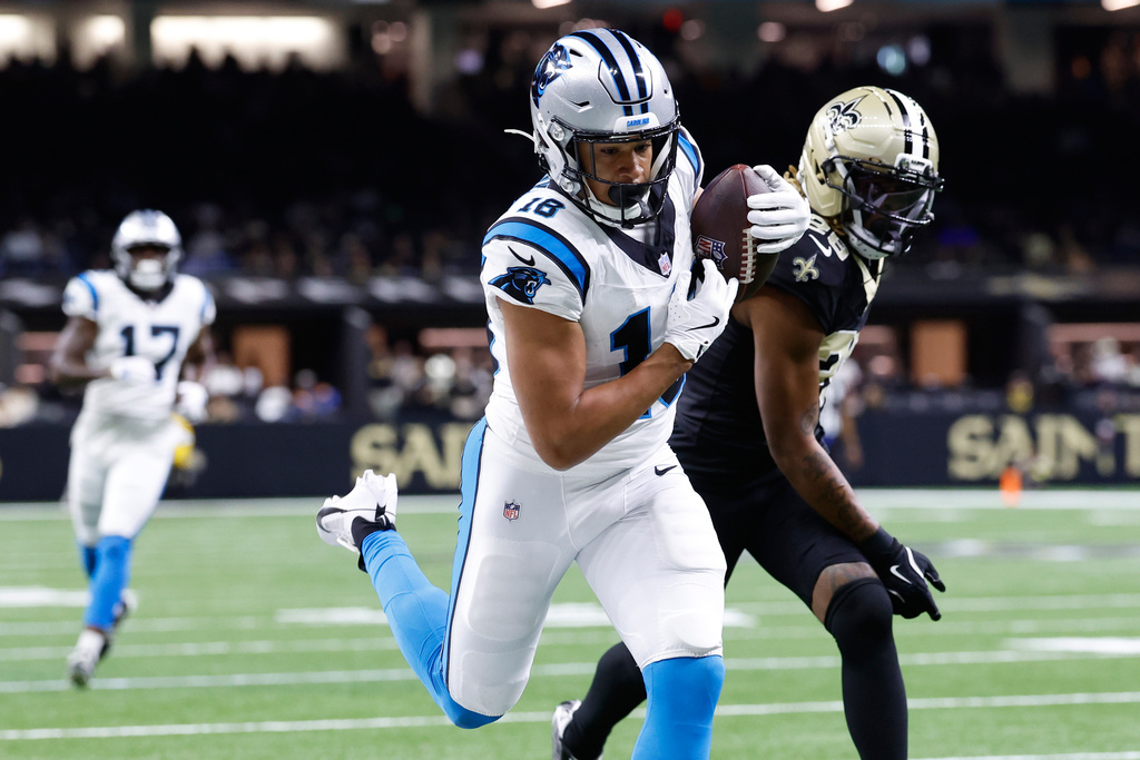 Carolina Panthers wide receiver Jalen Coker (18) catches a touchdown pass against New Orleans Saints cornerback Quincy Riley (29) in the second half of an NFL football game, Sunday, Dec. 14, 2025, in New Orleans. (AP Photo/Butch Dill)