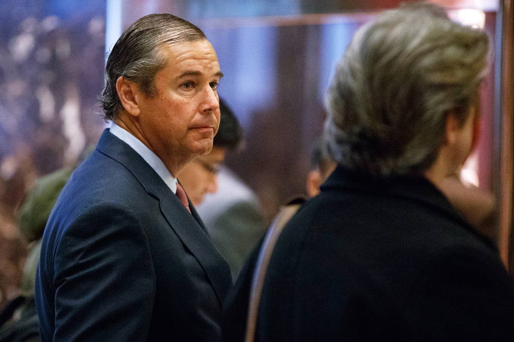 FILE - Ray Washburne waits for an elevator in the lobby of Trump Tower in New York on Nov. 30, 2016. (AP Photo/Evan Vucci, File)