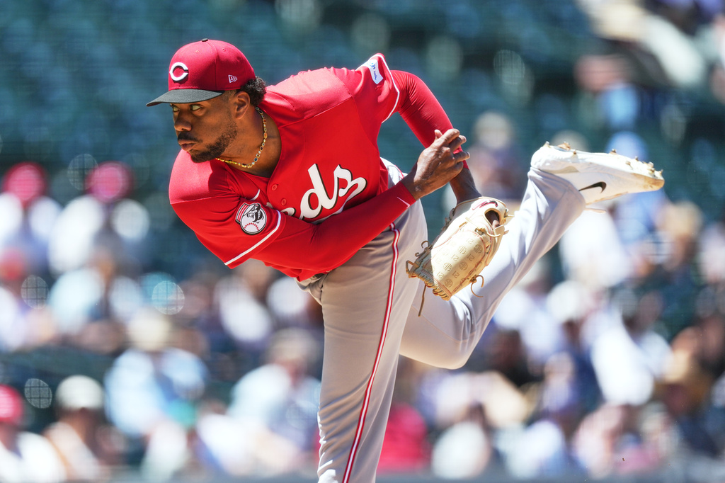 Cincinnati Reds starting pitcher Hunter Greene works against the Colorado Rockies in the first inning of a baseball game Sunday, July 19, 2026, in Denver. (AP Photo/David Zalubowski)