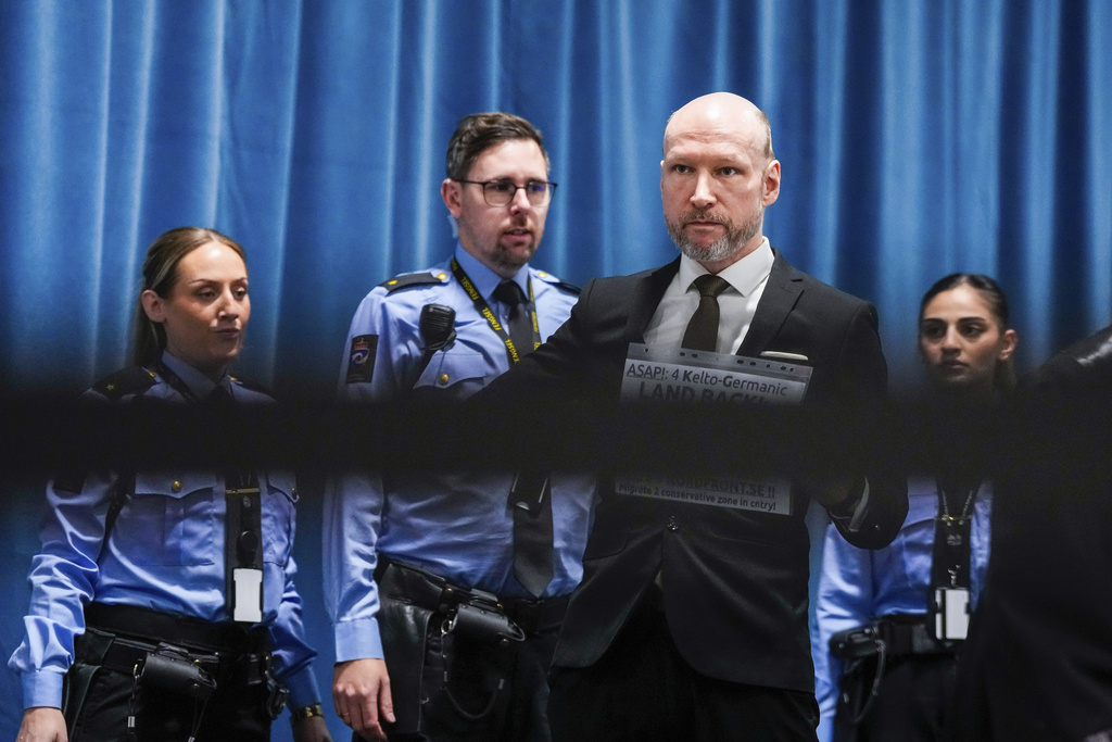 Anders Behring Breivik arrives at the courtroom for day one of the Ringerike, Asker and B&aelig;rum district court's processing of Fjotolf Hansen's petition for parole, in Tyristrand, Norway, Tuesday, Nov. 19, 2024. (Beate Oma Dahle/NTB Scanpix via AP)