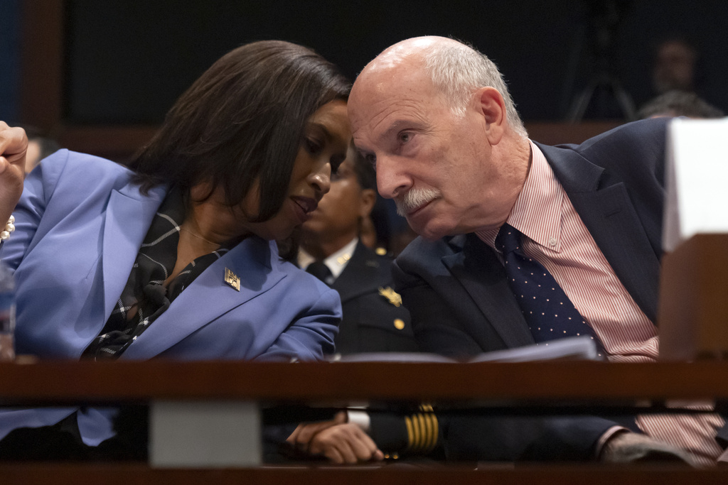 District of Columbia Mayor Muriel Bowser, left, and D.C. Council Chairman Phil Mendelson talk during a hearing of the House Committee on Oversight and Government Reform on Capitol Hill, Thursday, Sept. 18, 2025, in Washington. (AP Photo/Mark Schiefelbein)