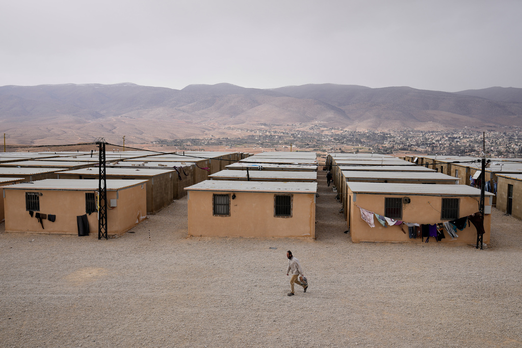 A Syrian Shiite man walks at the Imam Ali Housing Compound, where hundreds of mostly Lebanese and Syrian Shiite Muslims displaced from Syria reside, in Hermel, northeast Lebanon, Friday, Jan. 30, 2026. (AP Photo/Hussein Malla)