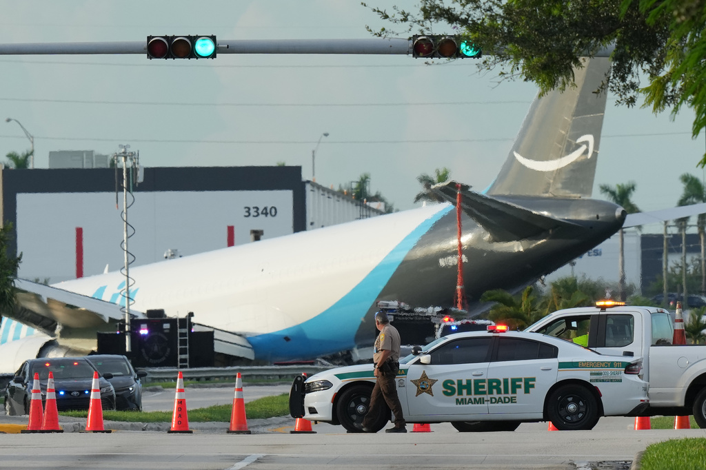 An Amazon cargo plane sits at the Miami International Airport (MIA) after it overshot the runway, Sunday, Sept. 6, 2026. (AP Photo/Lynne Sladky)
