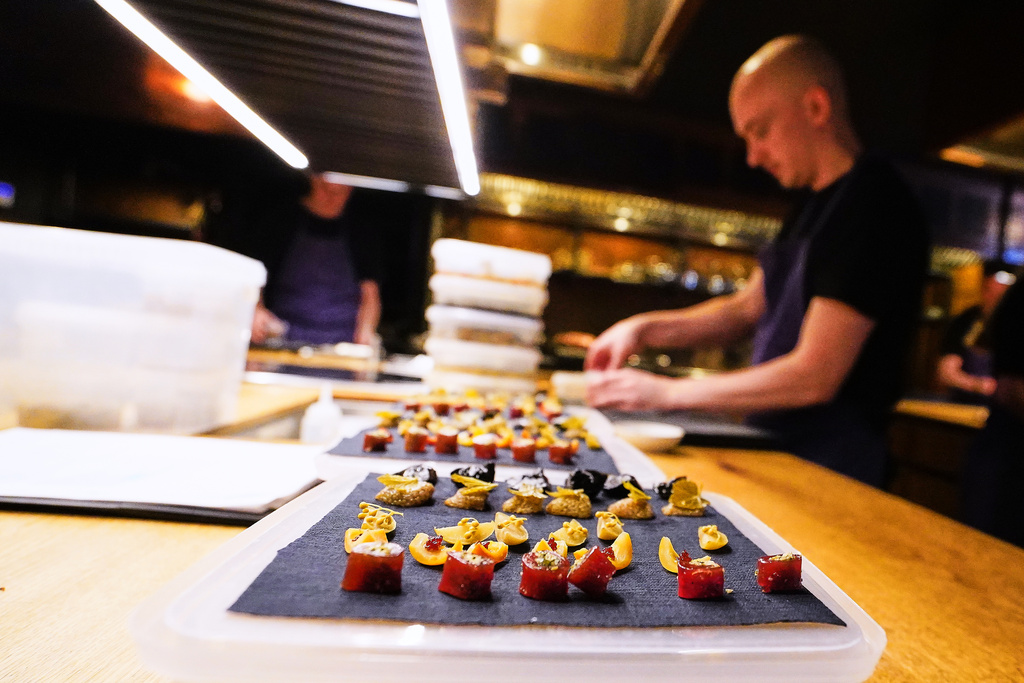 Chiefs prepare food at the restaurant Kadeau in Copenhagen, Denmark, Feb. 12, 2026. (AP Photo/James Brooks)