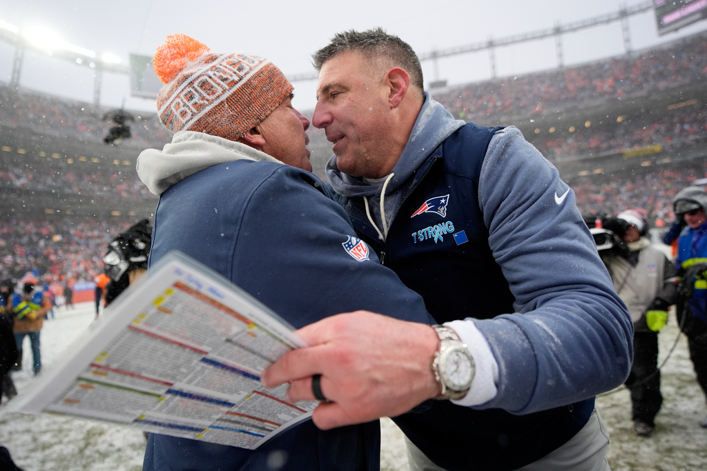 Denver Broncos head coach Sean Payton and New England Patriots head coach Mike Vrabel meet after the AFC Championship NFL football game between the Denver Broncos and the New England Patriots, Sunday, Jan. 25, 2026, in Denver. (AP Photo/John Locher)