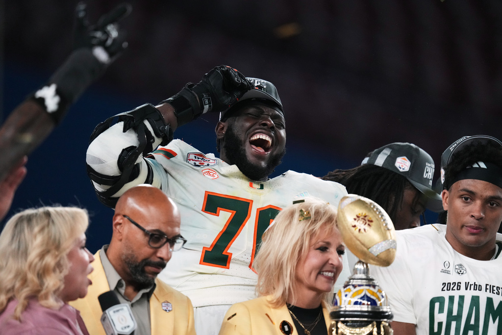Miami offensive lineman Markel Bell celebrates after winning the Fiesta Bowl NCAA college football playoff semifinal game against Mississippi, Thursday, Jan. 8, 2026, in Glendale, Ariz. (AP Photo/Ross D. Franklin)