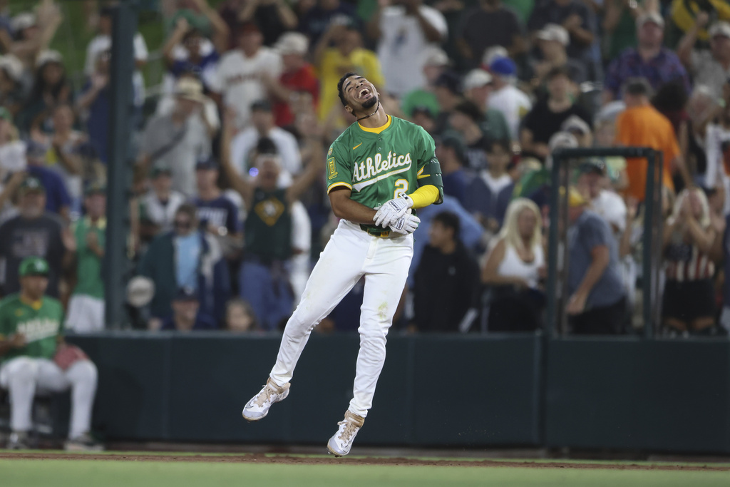 Athletics' Darell Hernaiz reacts after drawing a bases load walk off walk during the 10th inning of a baseball game against the Detroit Tigers, Tuesday, Aug. 26, 2025, in West Sacramento, Calif. (AP Photo/Scott Marshall)