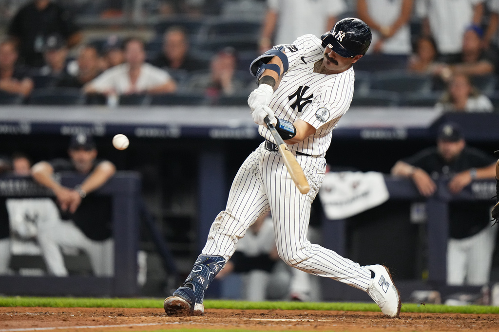New York Yankees' Austin Wells hits an RBI double during the ninth inning of a baseball game against the Atlanta Braves Friday, Aug. 7, 2026, in New York. (AP Photo/Frank Franklin II)
