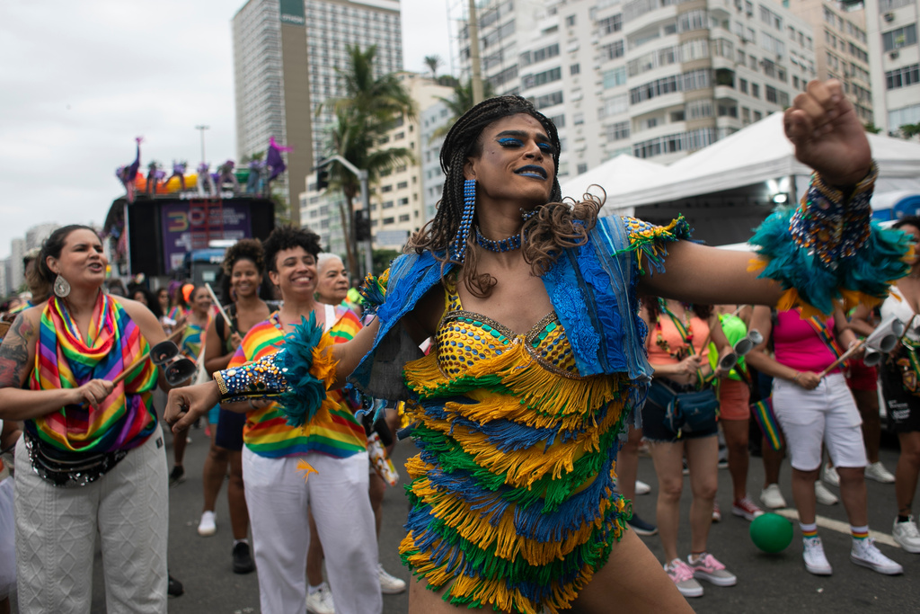 Alessandra Salazary dances during the annual Rio Pride parade along Copacabana Beach in Rio de Janeiro, Sunday, Nov. 23, 2025. (AP Photo/Bruna Prado)