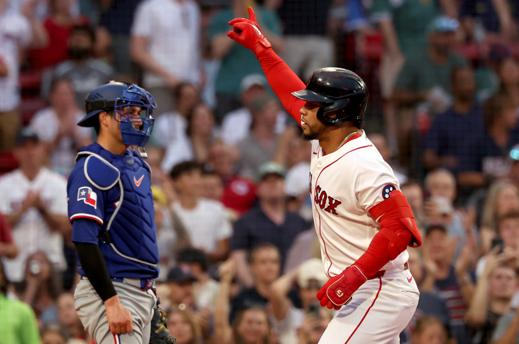Boston Red Sox's Willson Contreras gestures after hitting a home run during the second inning of a baseball game against the Texas Rangers, Sunday, June 14, 2026, in Boston. (AP Photo/Mark Stockwell)