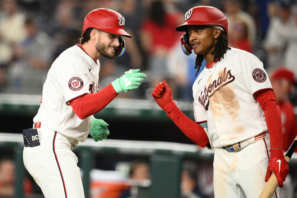 Washington Nationals' Dylan Crews, left. celebrates his solo home run with CJ Abrams, right, during the fourth inning of a baseball game against the Toronto Blue Jays, Tuesday, July 28, 2026, in Washington. (AP Photo/Nick Wass)