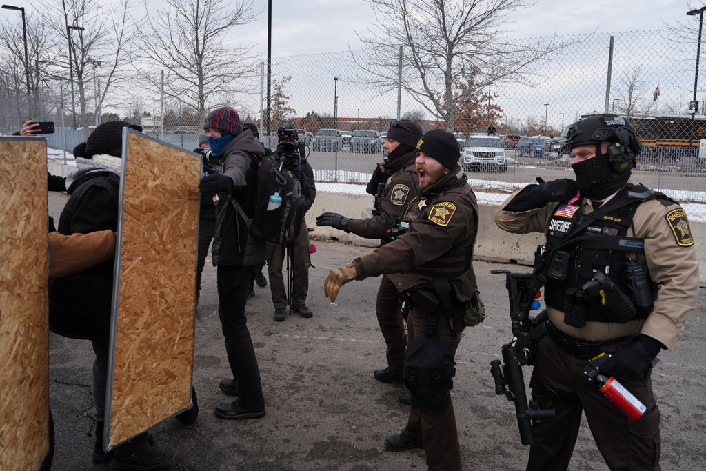 Counterprotesters clash with sheriff's deputies during a demonstration against Jake Lang on Saturday, Feb. 7, 2026, in Minneapolis. (AP Photo/Ryan Murphy)