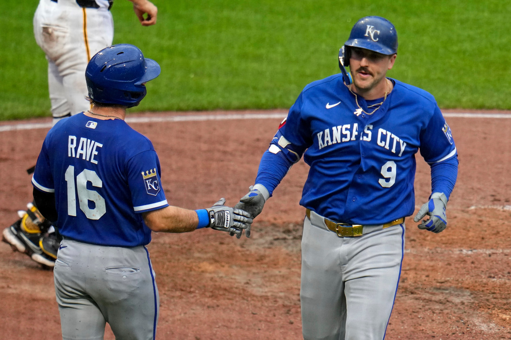 Kansas City Royals' Vinnie Pasquantino (9) celebrates with John Rave (16) as he heads to the dugout after hitting a two-run home run off Pittsburgh Pirates pitcher Carmen Mlodzinski during the seventh inning of a baseball game in Pittsburgh, Sunday, Sept. 20, 2026. (AP Photo/Gene J. Puskar)
