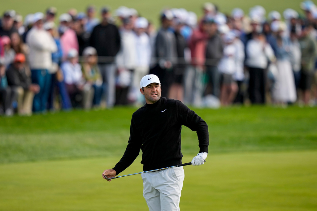 Scottie Scheffler watches his shot on the 10th green during the second round of the PGA Championship golf tournament at Aronimink Golf Club, Friday, May 15, 2026, in Newtown Square, PA. (AP Photo/Matt Slocum)