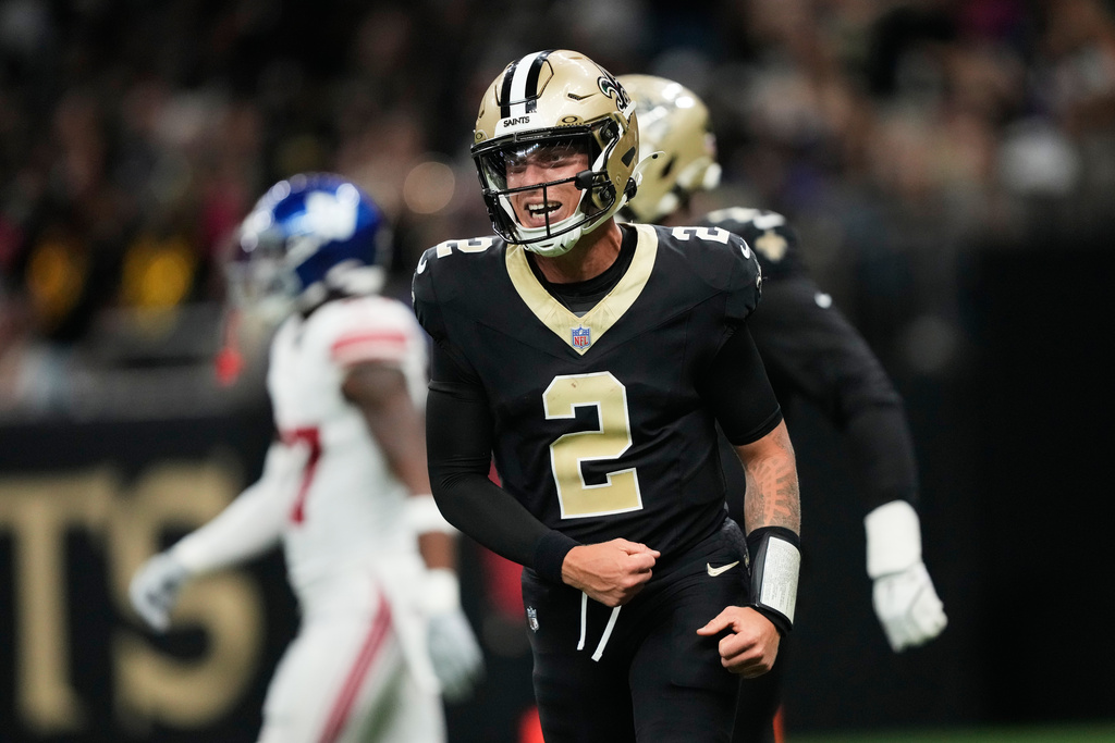 New Orleans Saints quarterback Spencer Rattler (2) celebrates his touchdown pass with offensive tackle Kelvin Banks Jr. (71) in the first half of an NFL football game against the New York Giants in New Orleans, Sunday, Oct. 5, 2025. (AP Photo/Gerald Herbert)