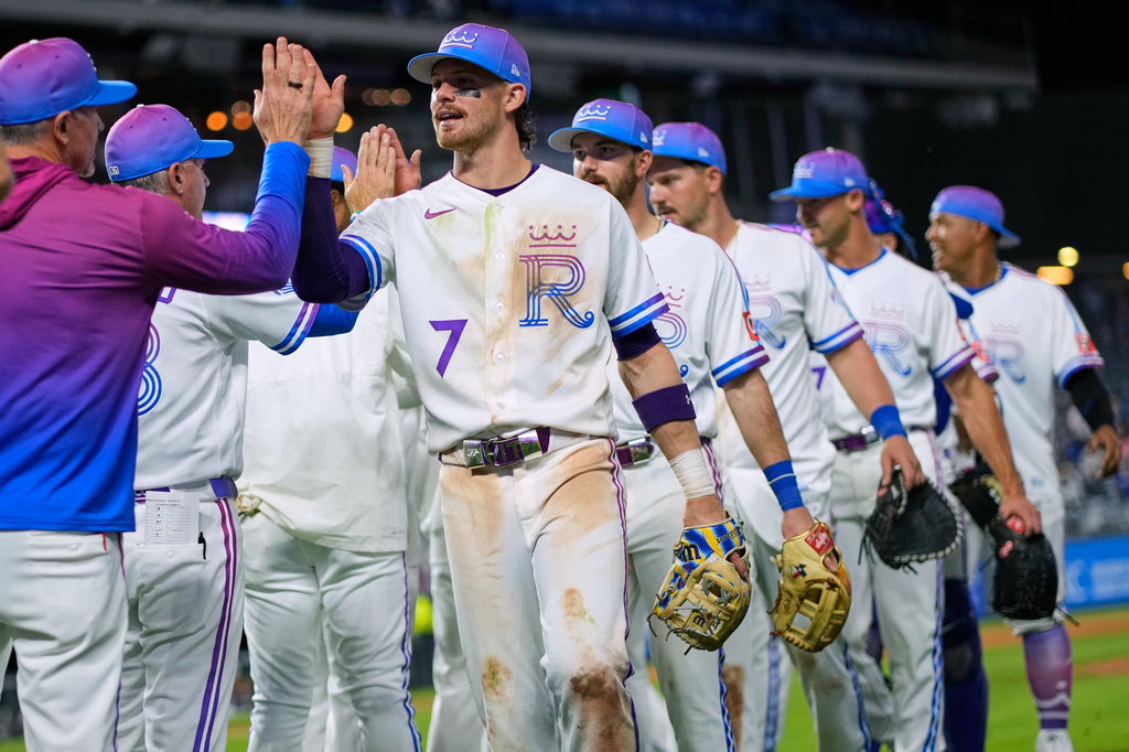 Kansas City Royals' Bobby Witt Jr. (7) celebrates with teammates after their baseball game against the Los Angeles Angels, Saturday, April 25, 2026, in Kansas City, Mo. (AP Photo/Charlie Riedel)
