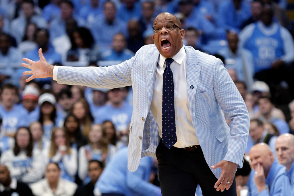 North Carolina head coach Hubert Davis yells instructions to the team during the first half of an NCAA college basketball game against Duke, Saturday, Feb. 7, 2026, in Chapel Hill, N.C. (AP Photo/Chris Seward)