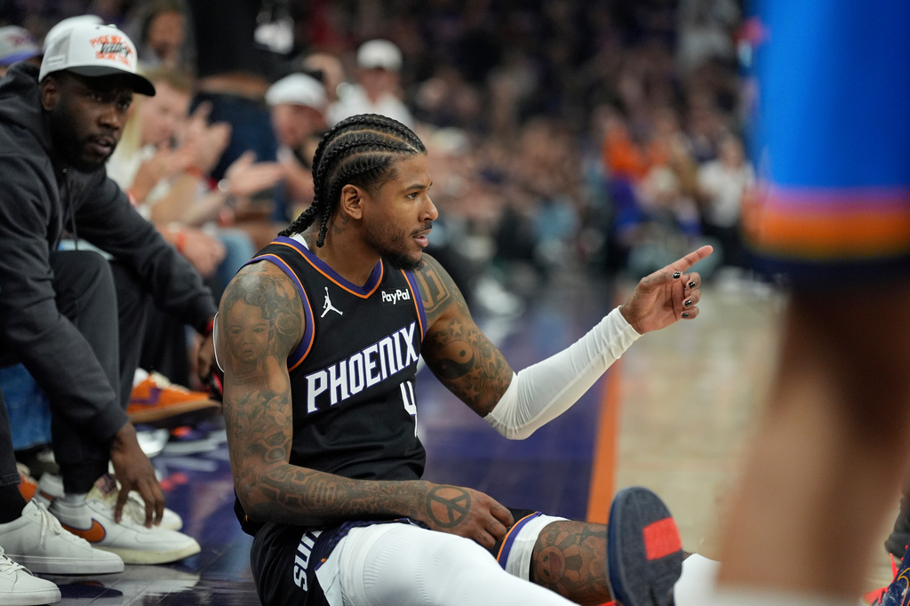 Phoenix Suns guard Jalen Green celebrates a 3-pointer after being fouled during the first half of Game 3 of a first-round NBA playoffs basketball series against the Oklahoma City Thunder, Saturday, April 25, 2026, in Phoenix. (AP Photo/Ross D. Franklin)