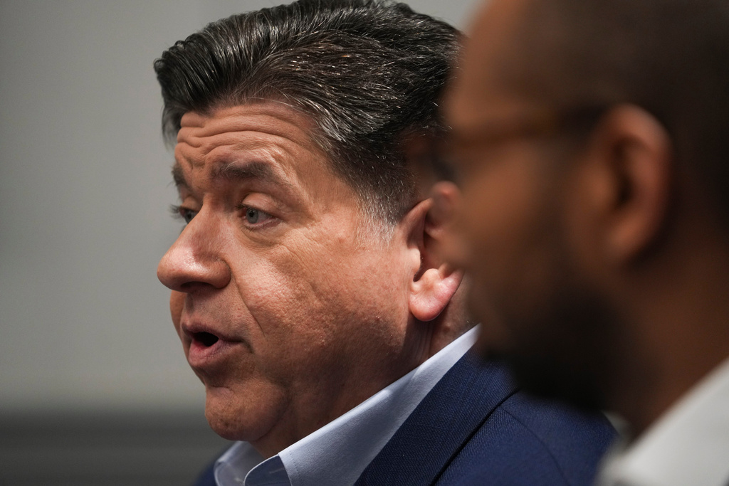Illinois Gov. JB Pritzker with running mate, for lieutenant governor, Christian Mitchell speaks during an interview, Wednesday, March 18, 2026, in Chicago. (AP Photo/Erin Hooley)