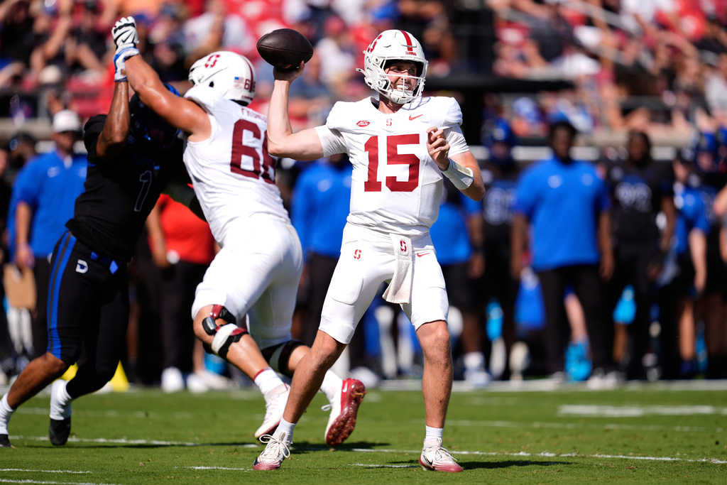 Stanford quarterback Ben Gulbranson (15) throws a pass in the first half of an NCAA college football game against SMU, Saturday, Oct. 11, 2025, in Dallas. (AP Photo/Tony Gutierrez)